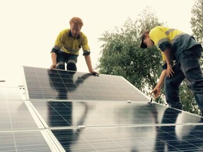 Solar panels funded by CORENA being installed on roof of Nannup Community Resource Centre, WA