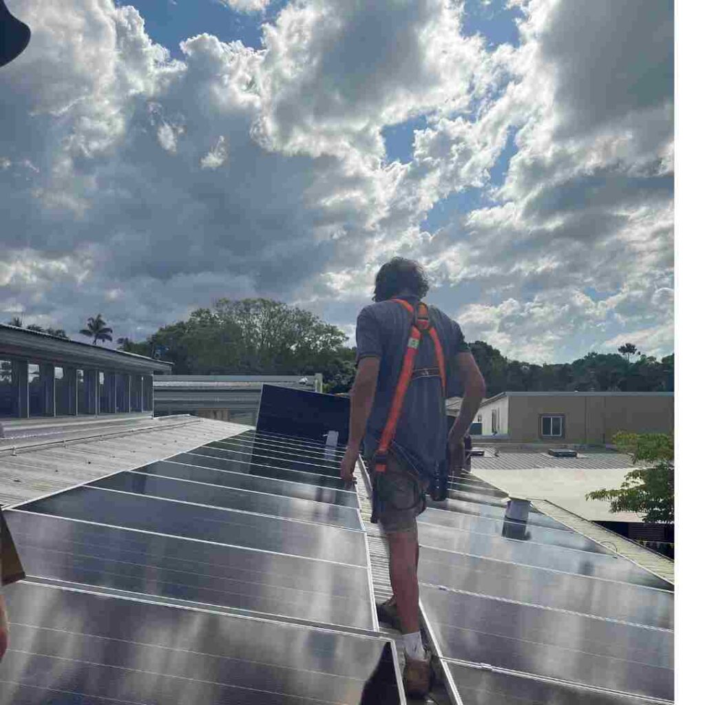 Installers installing a solar system at Byron Community College