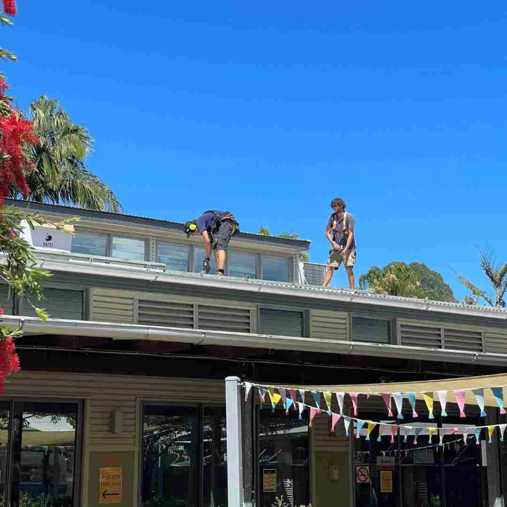 Installers installing a solar system at Byron Community College